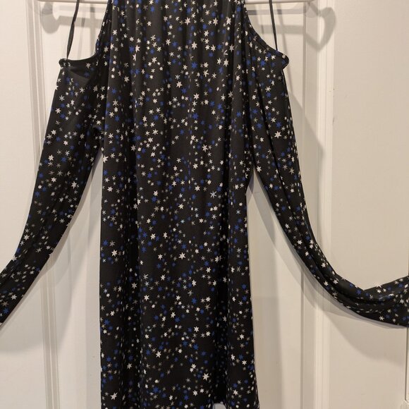 Michael Kors black top with white and blue star patterns and a silver chain on t - Picture 4 of 5